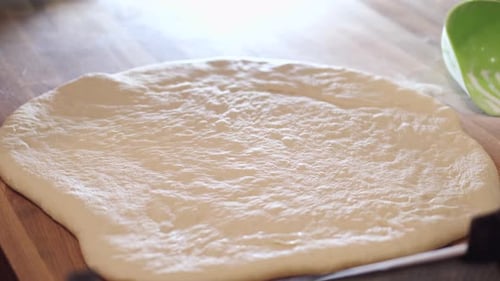 The Baker Is Cutting the Donut Pastry Into Round Shapes.