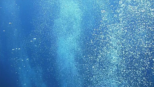 Rising Bubbles Underwater in the Deep Blue Sea