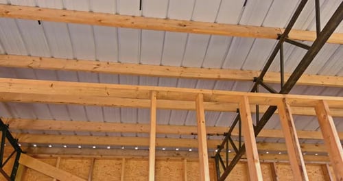 In a Metal Frame Warehouse the Roof is Covered with Panels of Roofing That are Made of Metal