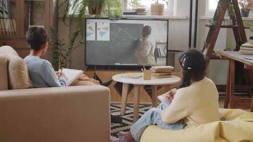 Diverse Kids Having School Lesson Remotely via Video Call at Home