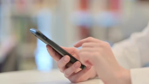 Close Up Female Hands Typing on Smartphone