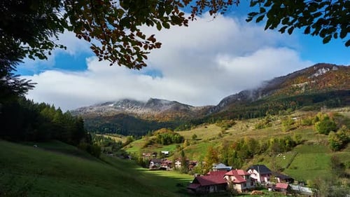 Village under mountain peaks, autumn changeable weather, arrival of rain, heavy clouds HD