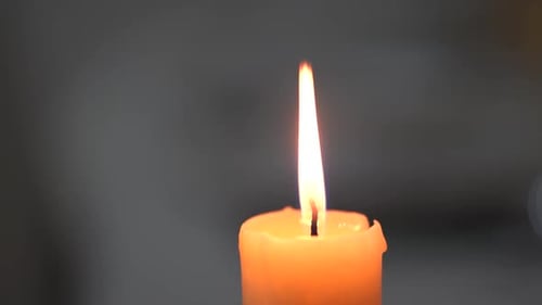Close Up of Burning Yellow Candle Flame
