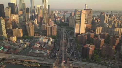 AERIAL: Tilt Up To Reveal Manhattan New York City Skyline at Sunset in Beautiful