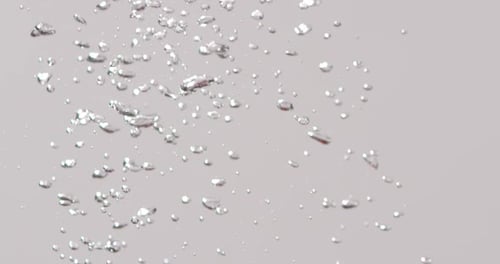 Tomatoes Splashing in Water with Bubbles