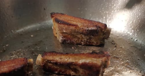 Meat Ribs Are Fried In A Frying Pan