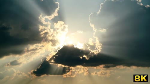 Dramatic Sunrays Through Ominous Clouds in the Sky