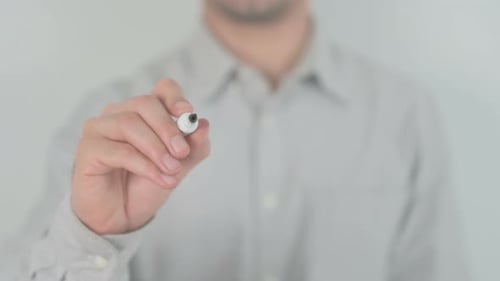 Hand Writes Power on Glass in Mid Shot