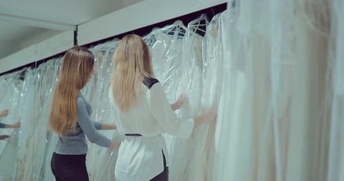 Women Browse Wedding Dresses in Boutique