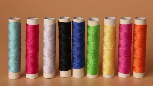 Man put Colorful threads , Sewing threads