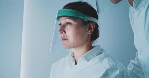 Scientists Working Together at Computer in Laboratory