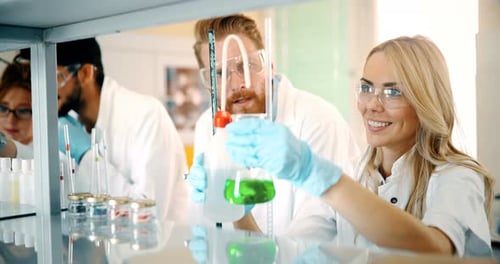 Female Scientist Examining Chemical Compound in Laboratory