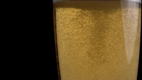 Detail of a beer with bubbles in the glass