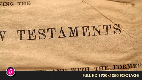 Antique book opens to New Testaments page