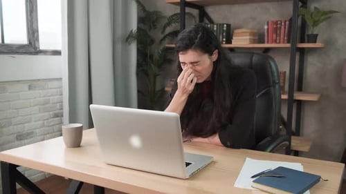 Feeling Tired and Stressed. Frustrated Young Woman Keeping Eyes Closed and Massaging Nose While