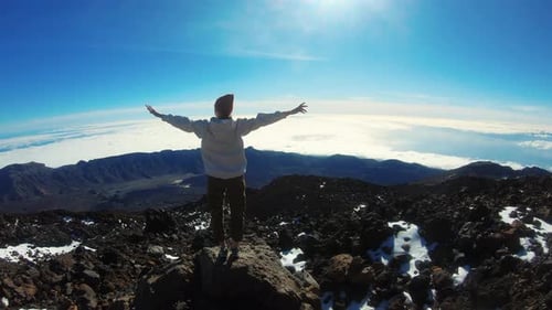 Young Woman Climbed to the Top of the Mountain