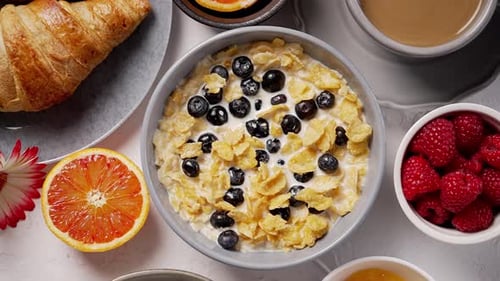 Healthy Breakfast Concept with Corn Flakes and Fresh Berries on White Table
