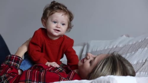 Mother have a fun with a child at home