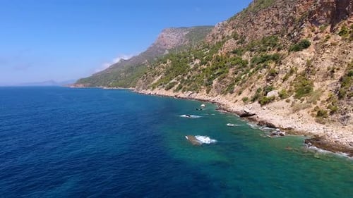 Aerial Clear Reef and Rocky Untouched Coastline of Bright Turquoise Sea