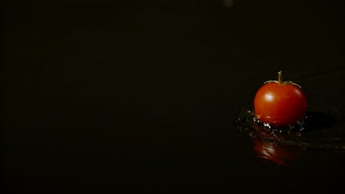 Tomato Falls into Water with Ripples