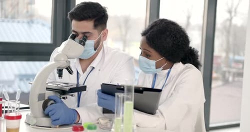 Scientists Working in Modern Medical Research Laboratory