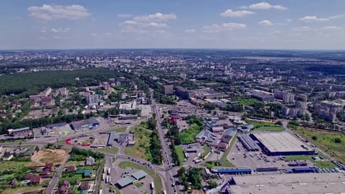 Drone Rises Above the Intersection of the Roads in a Suburb