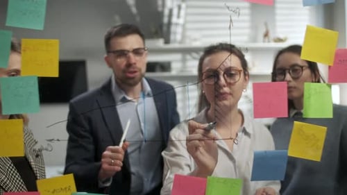 Team Analyzes Data Together During Creative Meeting