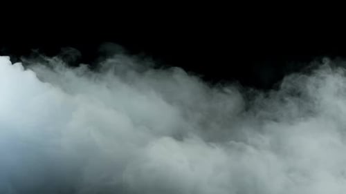 Dramatic White Fog Drifting Across Black Background
