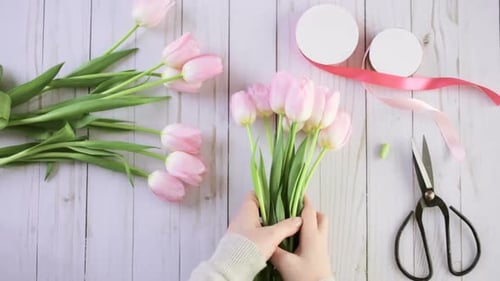 Arranging Pink Tulips into a Delicate Bouquet
