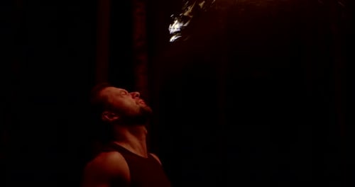 Bearded Man Performing Fire Breathing Trick
