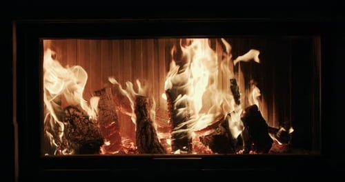 Firewood is Burning in a Modern Stylish Fireplace