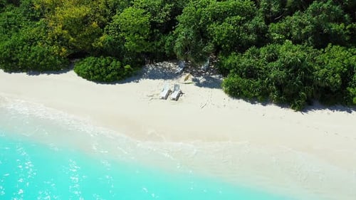 Daytime drone island view of a white paradise beach and aqua blue ocean background