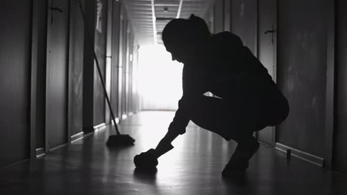 Tired Janitor Scrubbing Floor