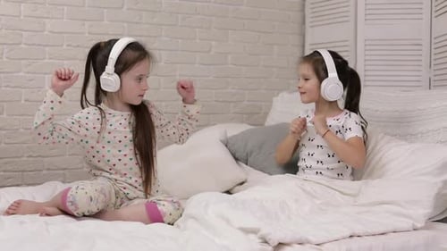 Two Girls Enjoying Music on Headphones