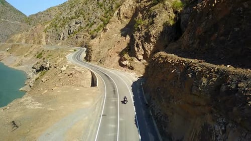 Motorbike Rider, Riding with River View of Ardahan Canyon, Turkey