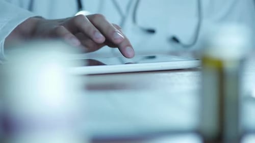 Doctor Using Tablet in a Hospital Office