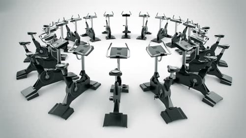Gym equipment stationary bikes standing in the circular array. Loopable. HD