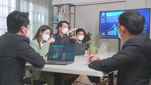 Business Meeting with Technology Presentation During Pandemic