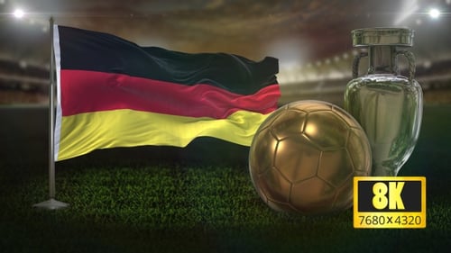 German Flag Waving with Golden Football and Silver Trophy