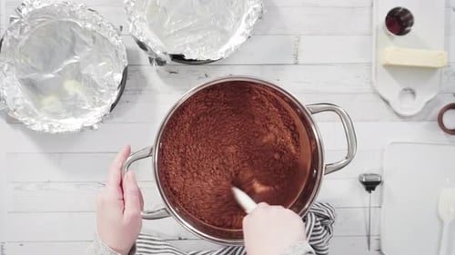 Flat lay. Step by step. Mixing ingredients in the cooking pot to make simple chocolate fudge.