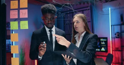 Professionals Brainstorming Business Strategy in a Modern Office