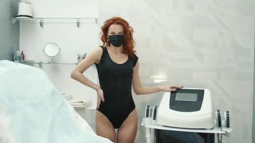 Woman in Bodysuit Posing in Medical Office