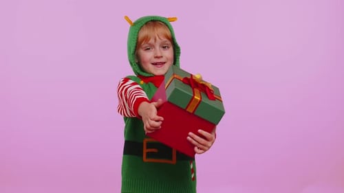 Joyful Child Elf Offers a Christmas Present