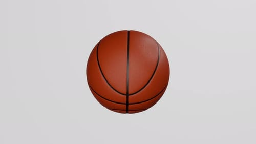 Classic basketball ball rotates on white background.
