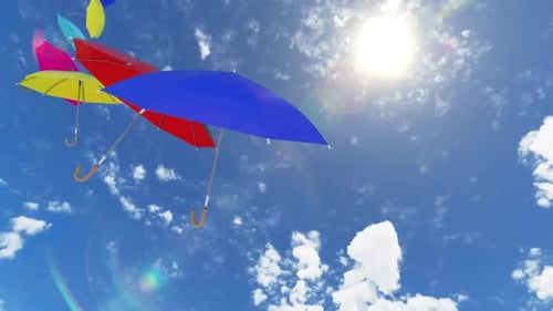 Multicolored umbrellas flying high to the sky against the sun with the wind