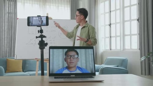 Online Teacher Giving Lesson To Student On Video Call