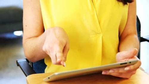 Woman Using Tablet Device in Workplace