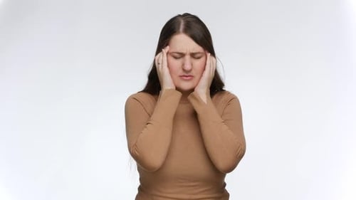 Woman Massaging Temples from Headache Pain