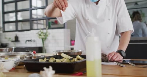 Chef Seasons Eggplant in Commercial Kitchen