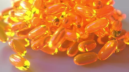 Orange Gel Capsules Falling Animation for Health and Nutrition